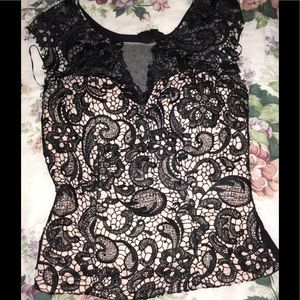 Sleeveless Black embroidered mesh top.